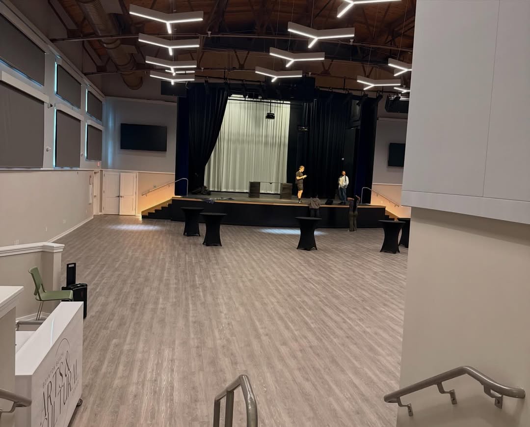 Empty event space with stage setup.